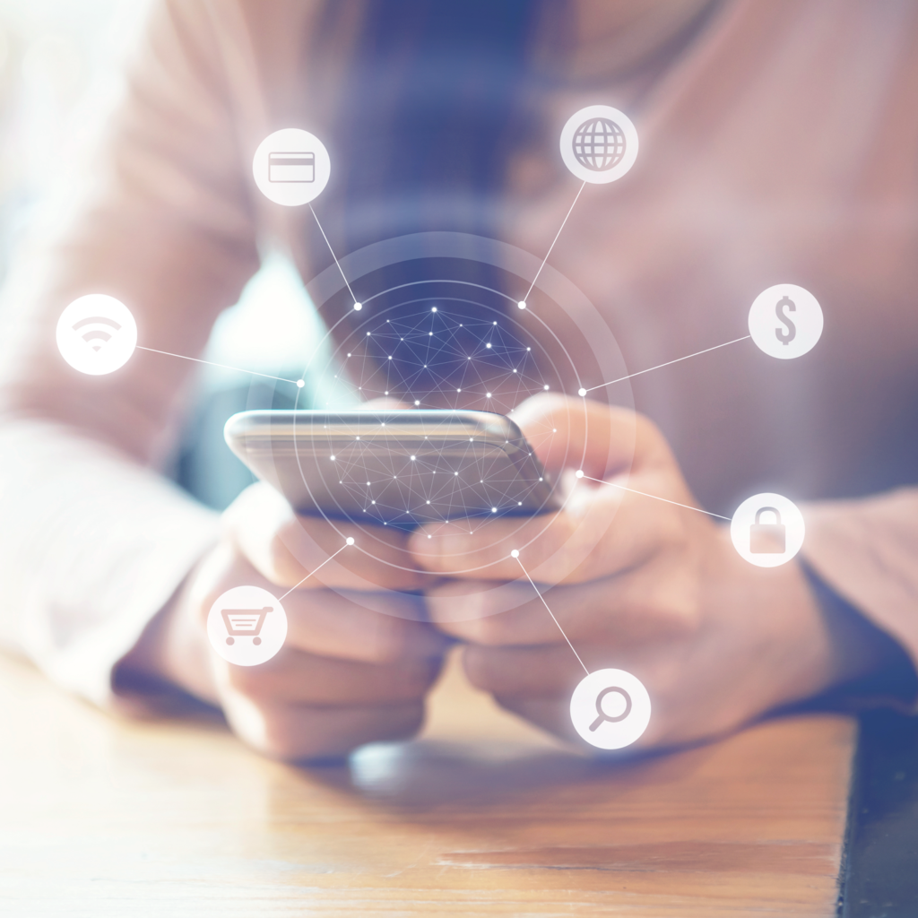 A man holding a phone with white icons showing that the item is being used to browse, search, connect pay for marketing purposes